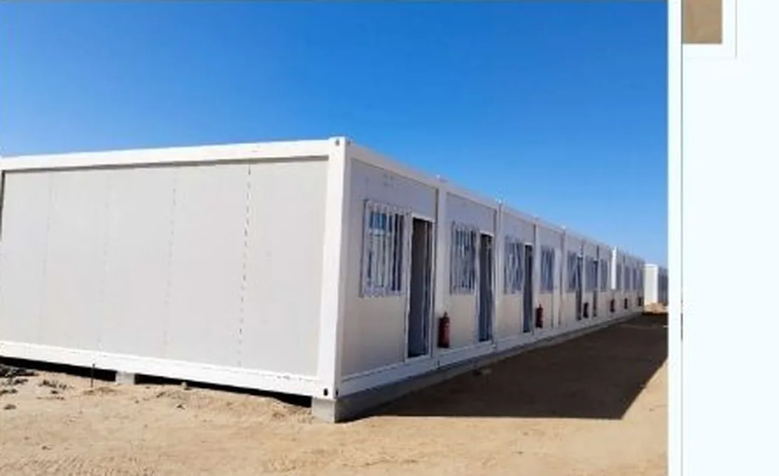 Modular site office units installed in line on a desert construction site
